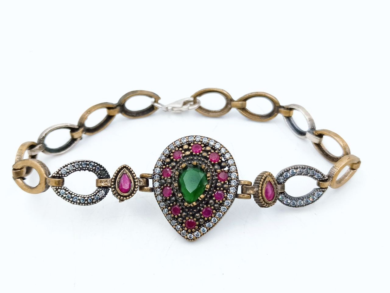 Silver and copper bracelet with rubies and emeralds