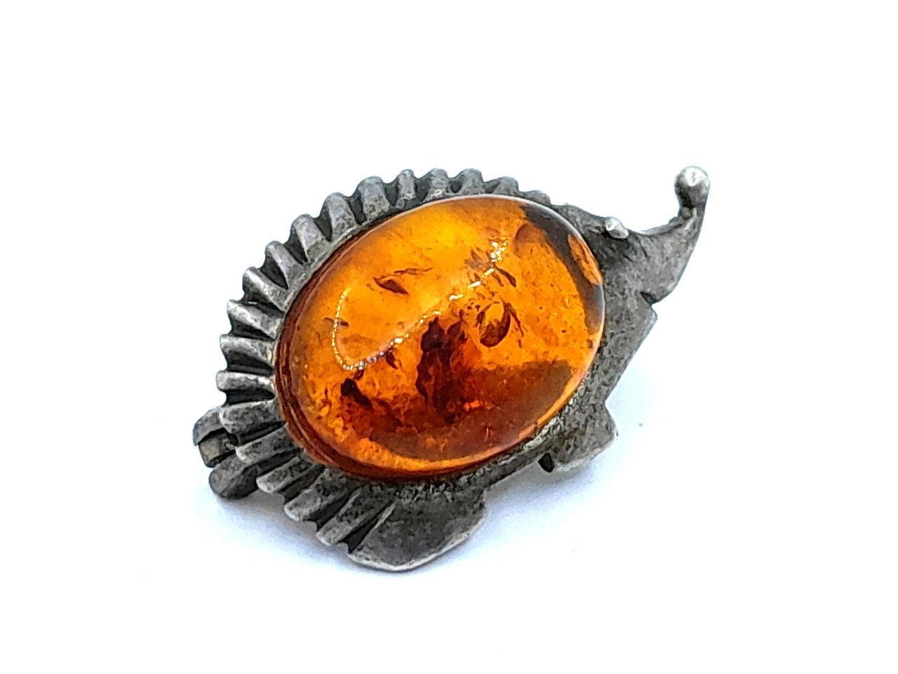 Silver and amber brooch