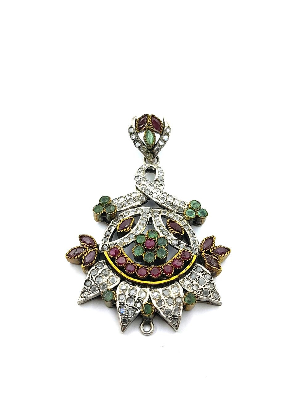 A pendant made of rubies and emeralds