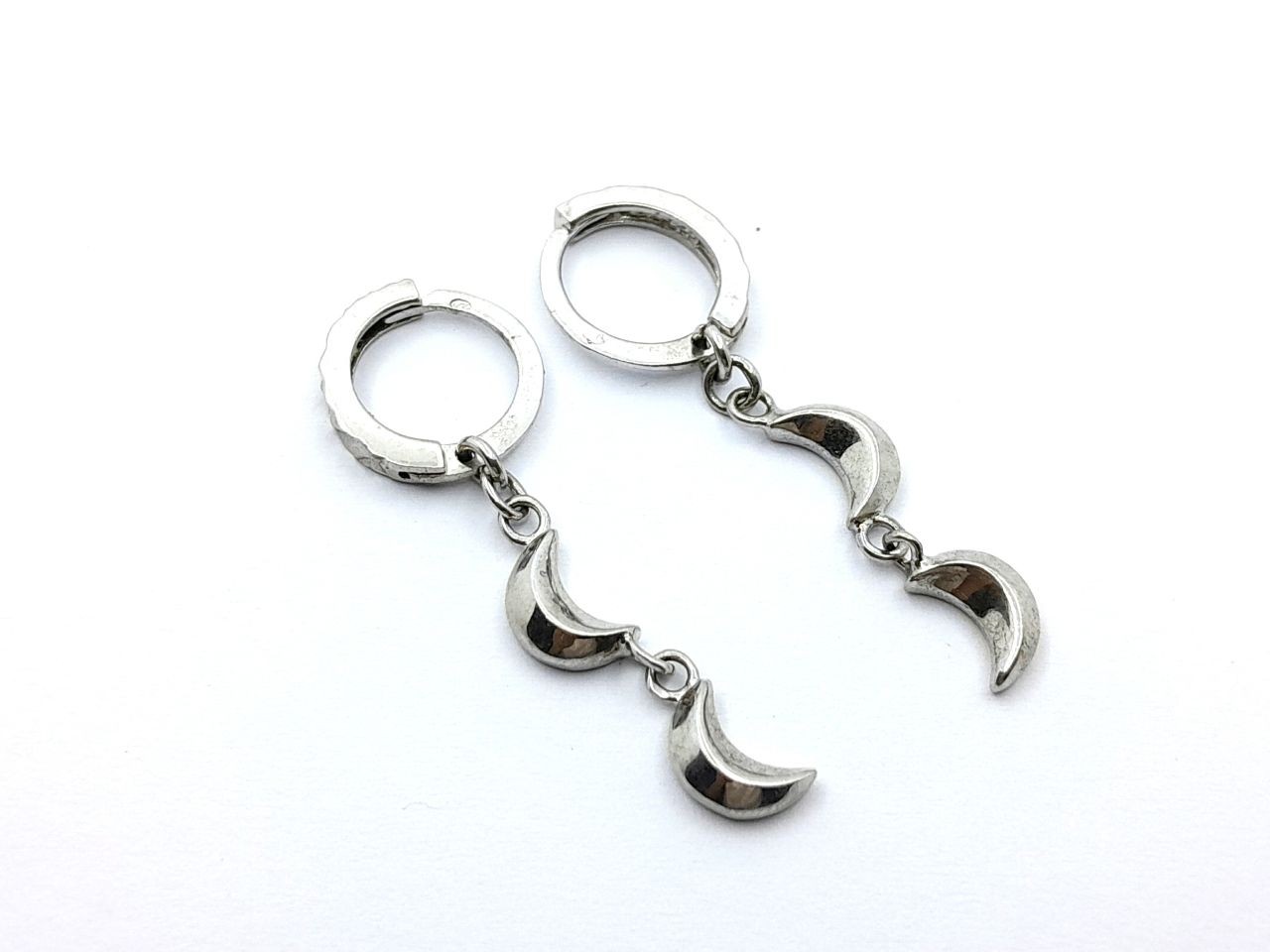 Silver earrings in the shape of a crescent