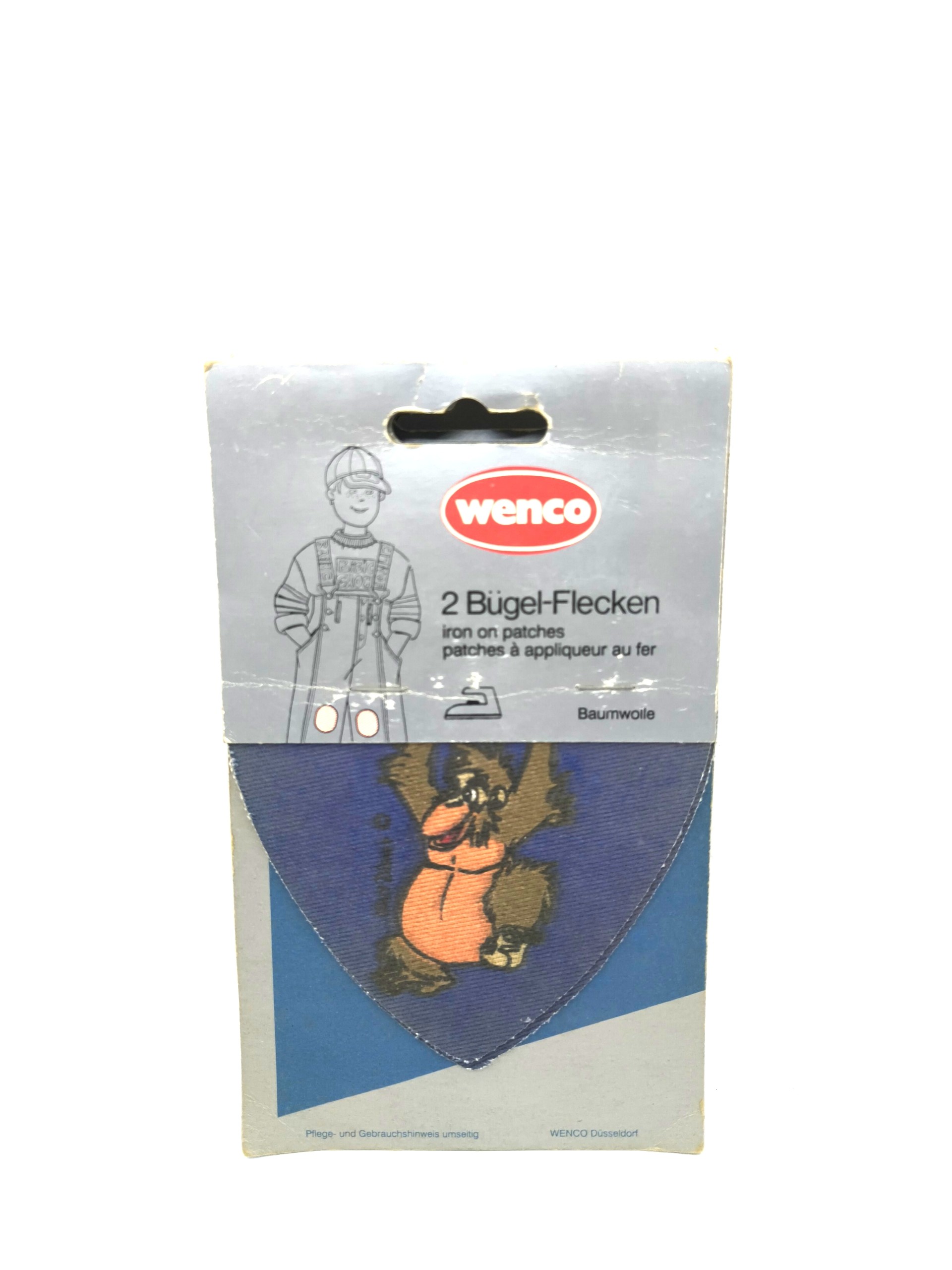 Cartoon character badge in the shape of a "monkey"