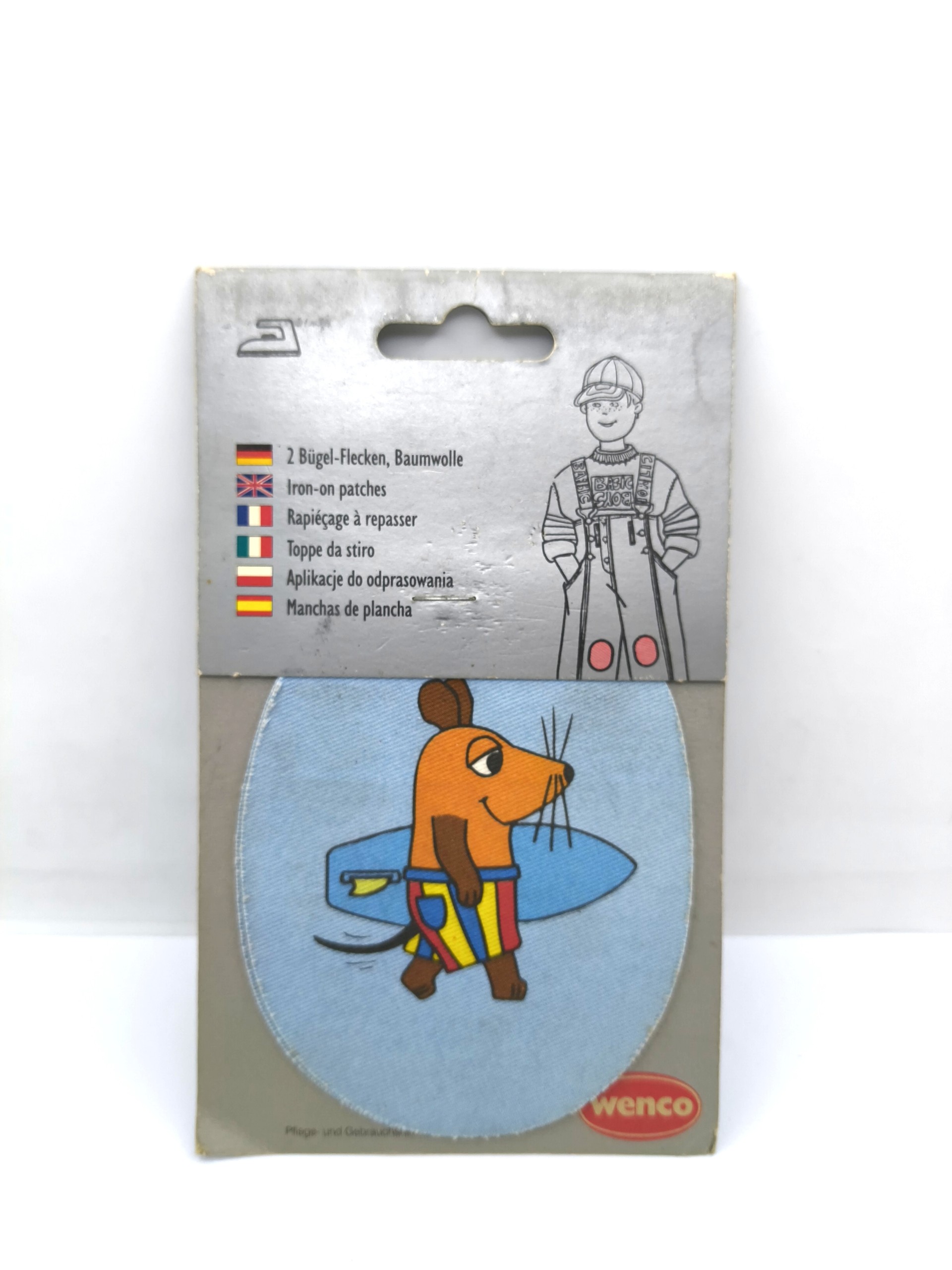 A badge featuring the cartoon character "DAXI"